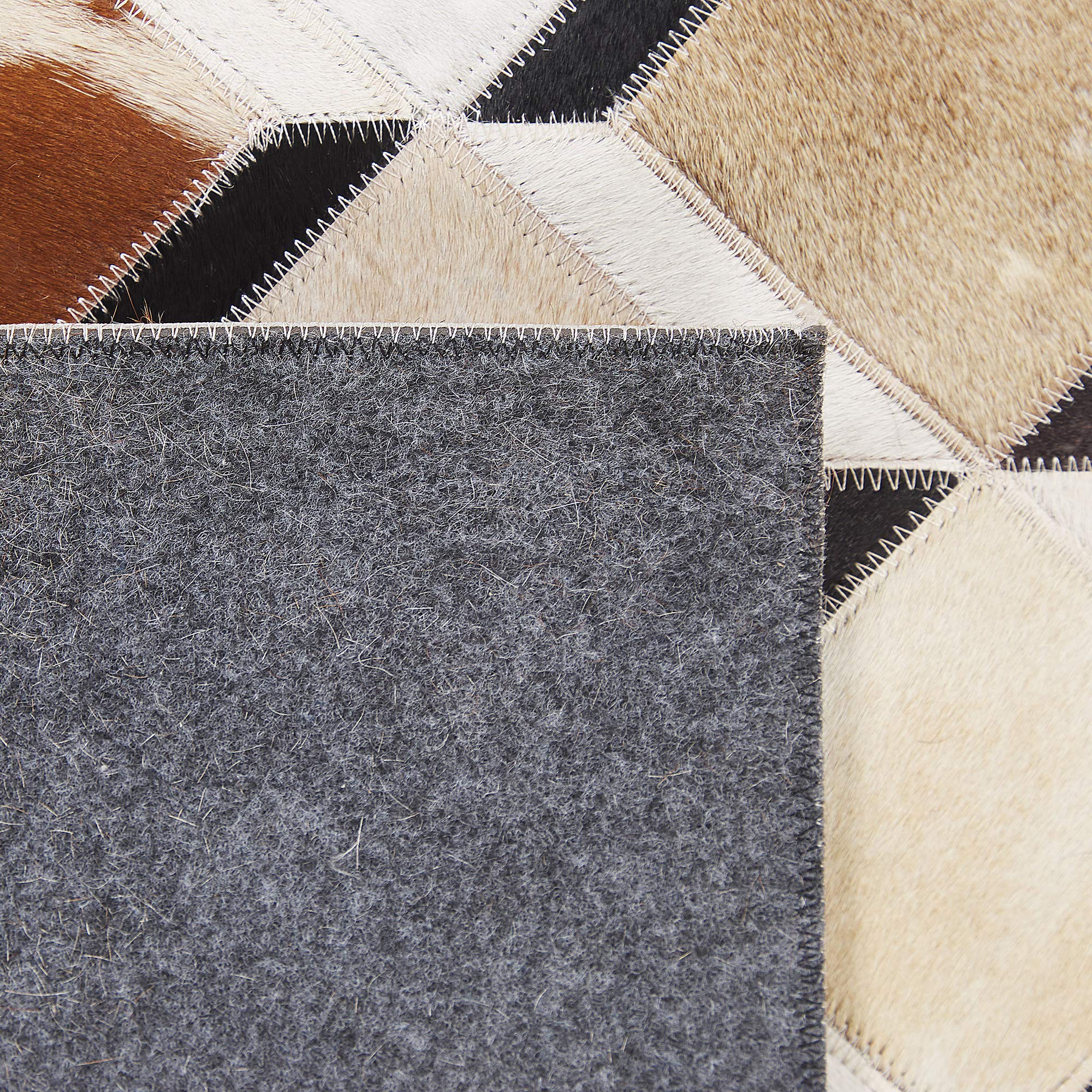 beliani-serinova-kuhfell-teppich-160x230-cm-braun-patchwork image 6
