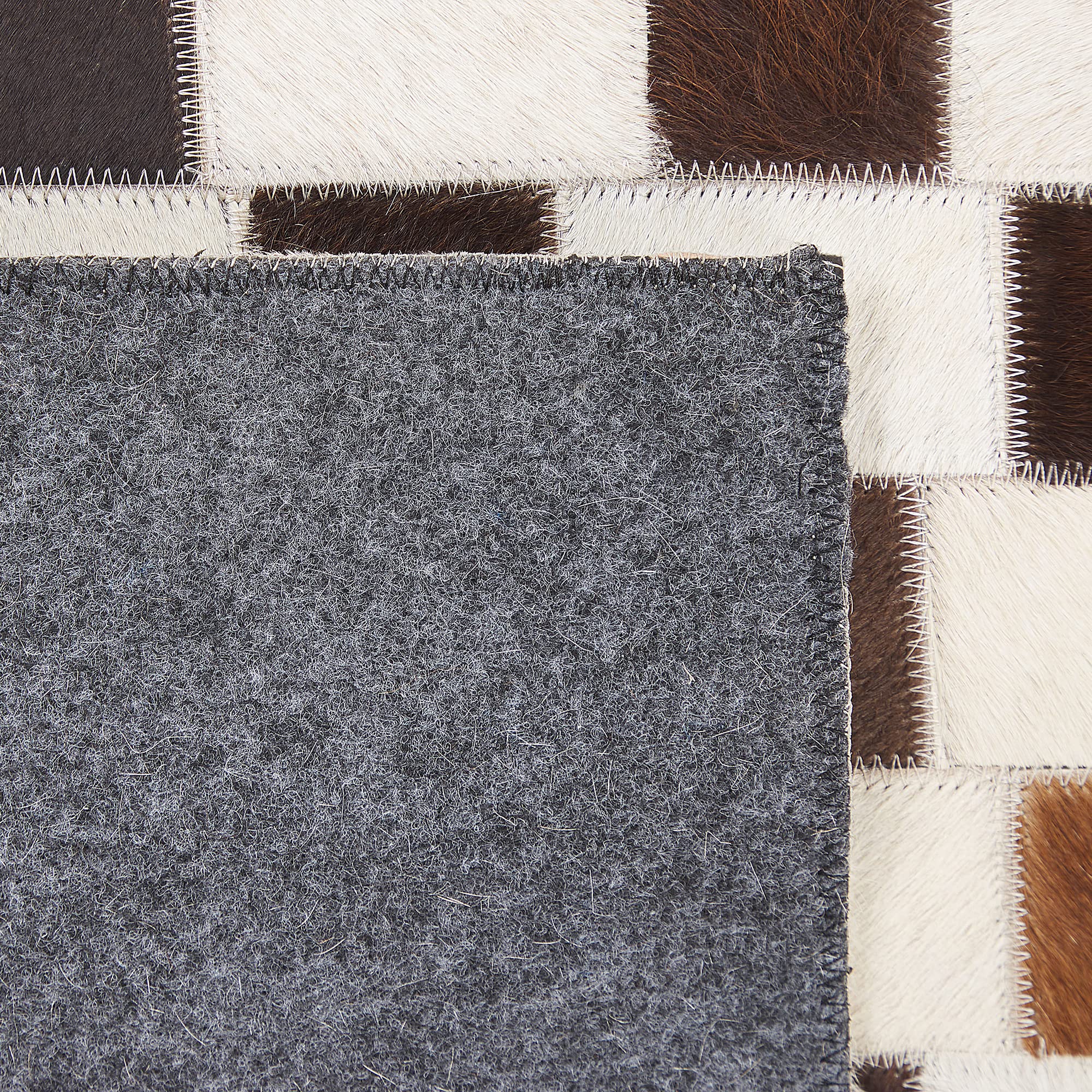 beliani-kayabey-kuhfell-teppich-140x200-braun-patchwork image 7